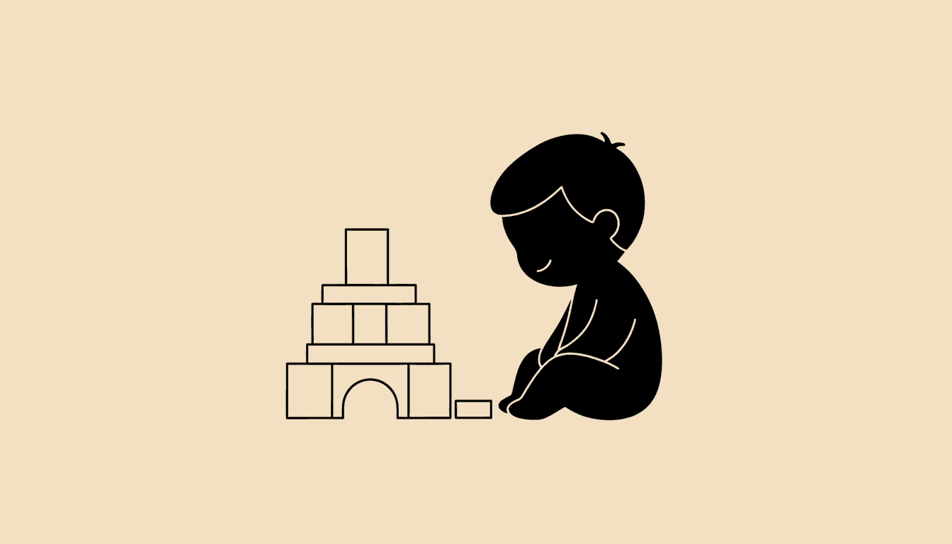 Child looking satisfied at a completed block tower